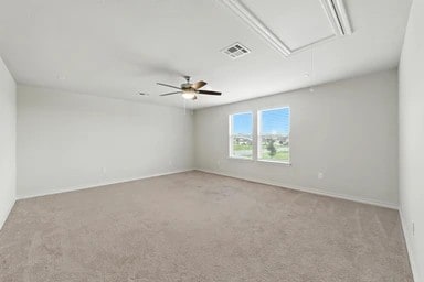 17320 Calipatria Ln, Pflugerville, TX 78660 - carpeted empty room with attic access and a ceiling fan