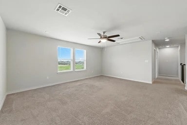 17320 Calipatria Ln, Pflugerville, TX 78660 - carpeted empty room featuring attic access and a ceiling fan