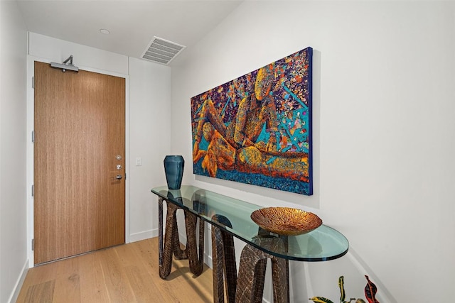 44 E Ave Unit 3801, Austin, TX 78701 - hall with light wood-style floors and baseboards