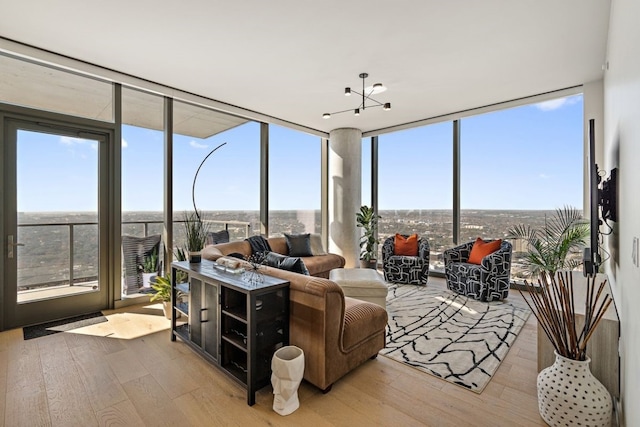 44 E Ave Unit 3801, Austin, TX 78701 - sunroom with hardwood / wood-style flooring, floor to ceiling windows, and healthy amount of natural light