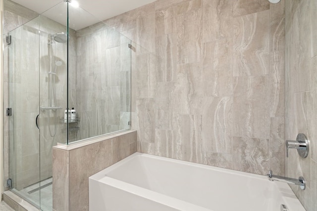 44 E Ave Unit 3801, Austin, TX 78701 - bathroom with a bath and a shower stall