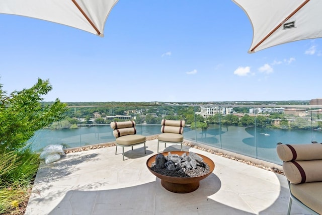 44 E Ave Unit 3801, Austin, TX 78701 - view of patio / terrace with an outdoor fire pit and a water view