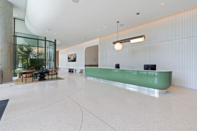 44 E Ave Unit 3801, Austin, TX 78701 - welcome area with floor to ceiling windows, a towering ceiling, and arched walkways