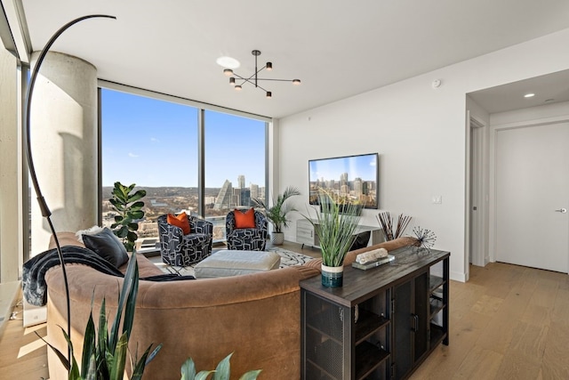 44 E Ave Unit 3801, Austin, TX 78701 - living area featuring wood finished floors, a chandelier, and expansive windows