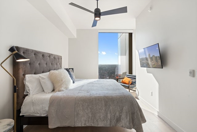44 E Ave Unit 3801, Austin, TX 78701 - bedroom featuring wood finished floors and a ceiling fan