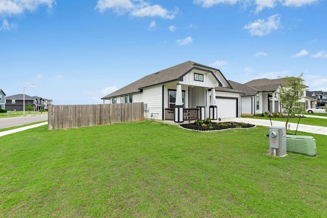 180 Yellowstone Dr, Kyle, TX 78640 - view of front of property with an attached garage, driveway, board and batten siding, and roof with shingles