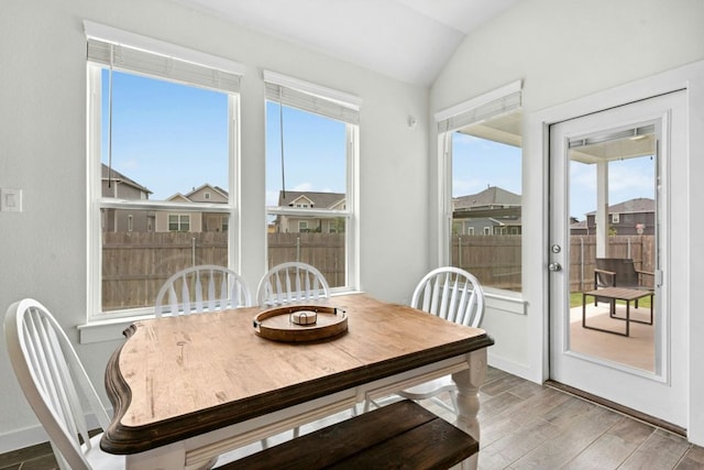 180 Yellowstone Dr, Kyle, TX 78640 - dining area with wood finished floors, vaulted ceiling, and healthy amount of natural light