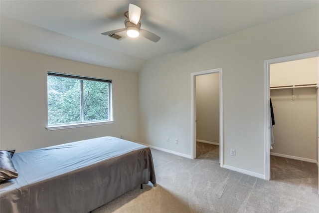 12816 Texas Sage Ct, Austin, TX 78732 - carpeted bedroom featuring a walk in closet, ceiling fan, lofted ceiling, and a closet