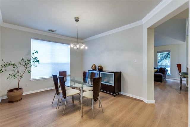 12816 Texas Sage Ct, Austin, TX 78732 - dining area featuring light wood-style floors and ornamental molding
