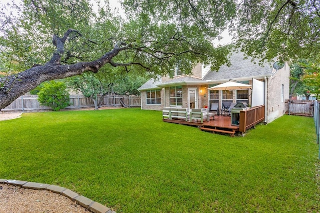 12816 Texas Sage Ct, Austin, TX 78732 - back of property featuring a fenced backyard, a deck, brick siding, and a shingled roof