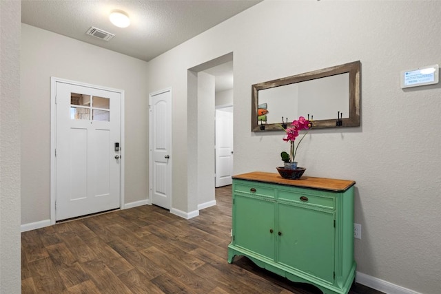 118 Craft St, Hutto, TX 78634 - foyer entrance with dark wood finished floors and baseboards