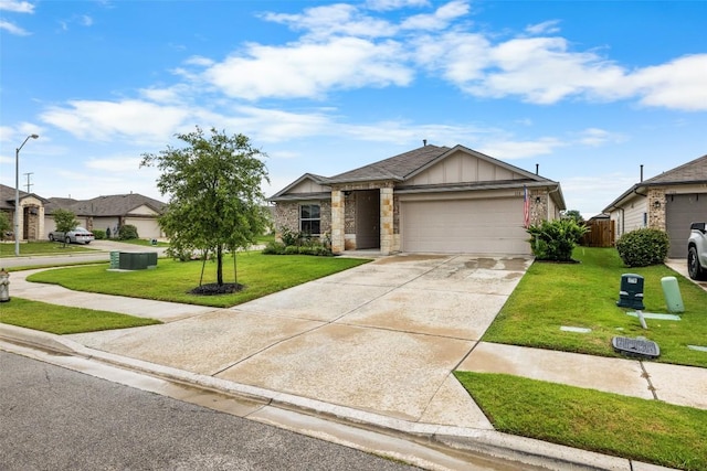 118 Craft St, Hutto, TX 78634 - view of front facade featuring an attached garage, board and batten siding, and concrete driveway