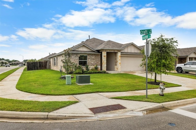 118 Craft St, Hutto, TX 78634 - view of front facade with stone siding, a garage, driveway, and board and batten siding