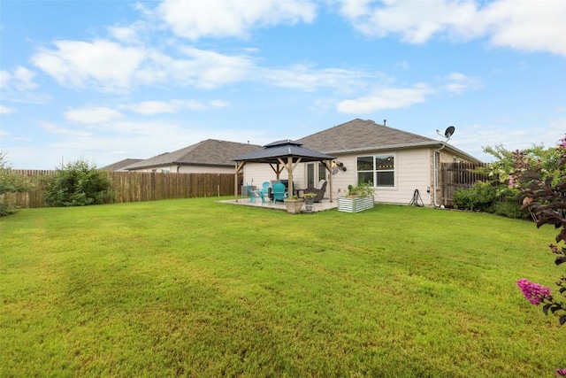 118 Craft St, Hutto, TX 78634 - back of house featuring a gazebo, a fenced backyard, and a patio area