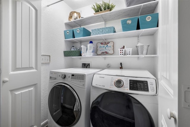 118 Craft St, Hutto, TX 78634 - laundry room with independent washer and dryer and a textured wall