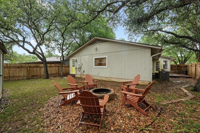 8406 Copano Dr, Austin, TX 78749 - back of property with an outdoor fire pit and a fenced backyard