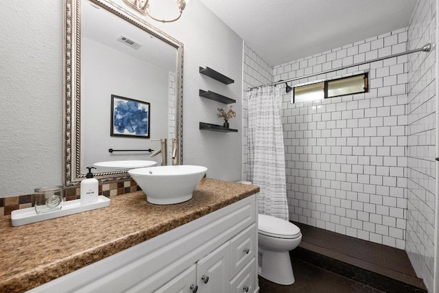 8406 Copano Dr, Austin, TX 78749 - bathroom featuring vanity and tiled shower