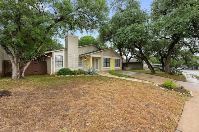 8406 Copano Dr, Austin, TX 78749 - view of front of home with a chimney and concrete driveway