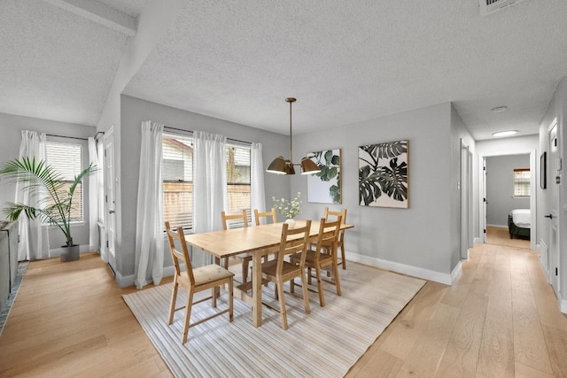8406 Copano Dr, Austin, TX 78749 - dining area with light wood-style floors and a textured ceiling