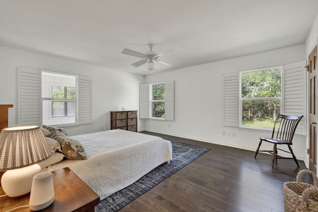 830 Palomino Ln, San Marcos, TX 78666 - bedroom with dark wood finished floors and ceiling fan