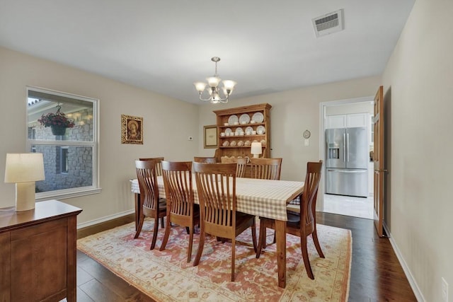 830 Palomino Ln, San Marcos, TX 78666 - dining room featuring a chandelier and dark wood-type flooring