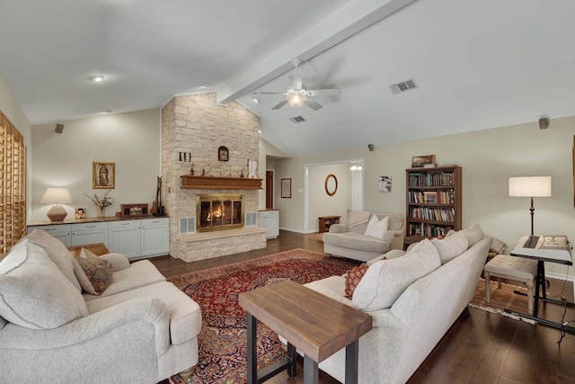 830 Palomino Ln, San Marcos, TX 78666 - living area with dark wood-style floors, ceiling fan, and a stone fireplace