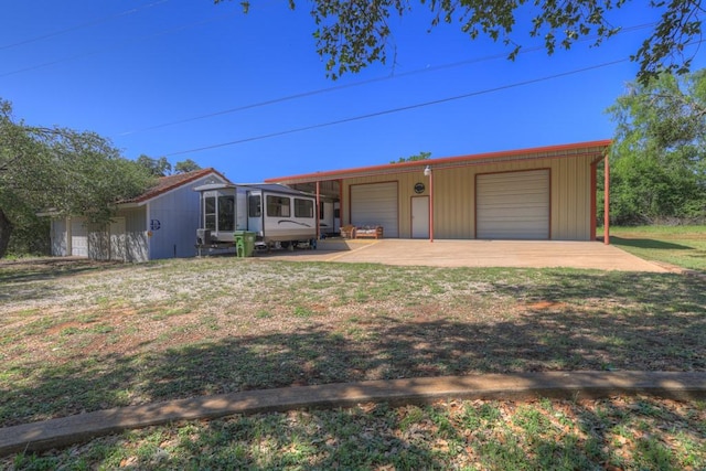 830 Palomino Ln, San Marcos, TX 78666 - view of front of property with an outdoor structure, a garage, and a front lawn