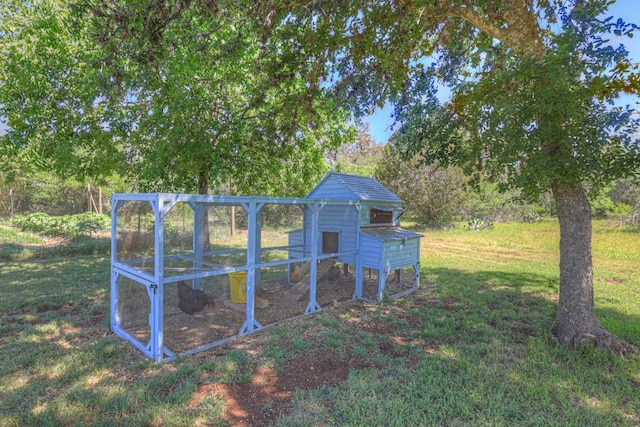 830 Palomino Ln, San Marcos, TX 78666 - view of grassy yard with exterior structure and an outdoor structure