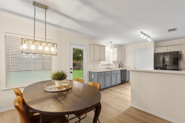 1449 Sir Thopas Trl, Austin, TX 78748 - dining area with light wood-style floors and baseboards