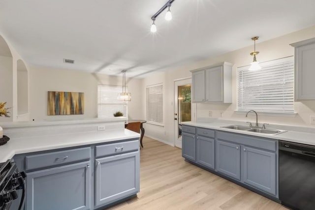 1449 Sir Thopas Trl, Austin, TX 78748 - kitchen with black dishwasher, gas range, and gray cabinets