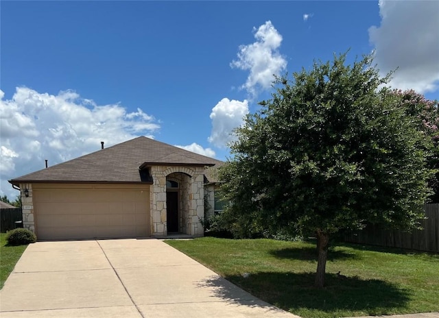 459 Langely, Kyle, TX 78640 - view of front of property featuring stone siding, a garage, concrete driveway, and a shingled roof