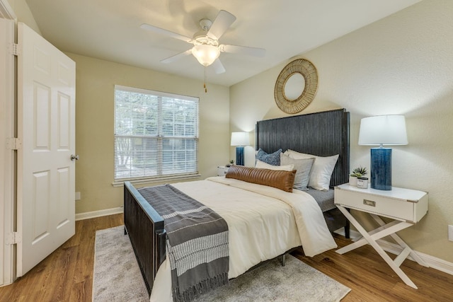 7685 Northcross Dr Unit 907, Austin, TX 78757 - bedroom with wood finished floors and a ceiling fan