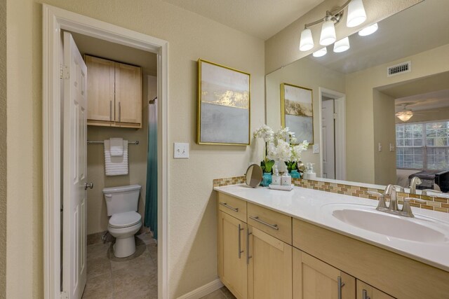 7685 Northcross Dr Unit 907, Austin, TX 78757 - full bathroom featuring vanity, tile patterned floors, tasteful backsplash, and a shower with shower curtain