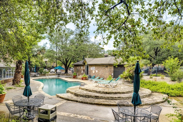 7685 Northcross Dr Unit 907, Austin, TX 78757 - community pool featuring a patio area