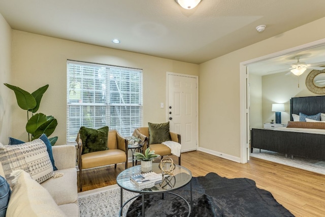 7685 Northcross Dr Unit 907, Austin, TX 78757 - living room with wood finished floors, a ceiling fan, and recessed lighting