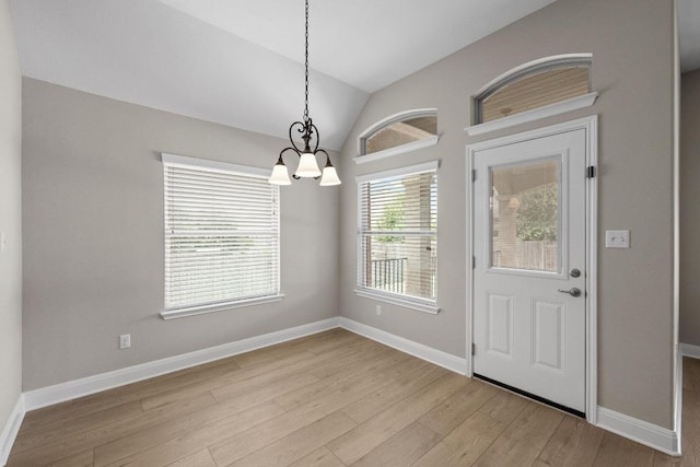 136 Firefall Ln, Austin, TX 78737 - entrance foyer featuring a chandelier, wood finished floors, and vaulted ceiling