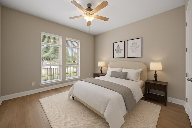 136 Firefall Ln, Austin, TX 78737 - bedroom with light wood finished floors and a ceiling fan