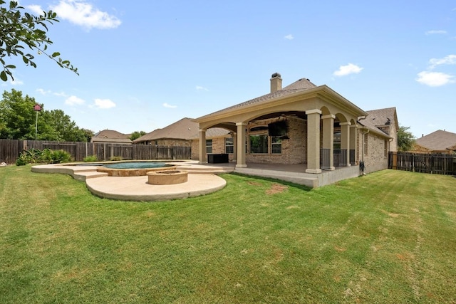 136 Firefall Ln, Austin, TX 78737 - back of house featuring a patio, a fenced backyard, a chimney, and brick siding