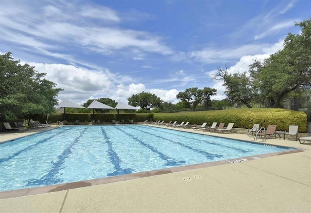 136 Firefall Ln, Austin, TX 78737 - community pool featuring a patio
