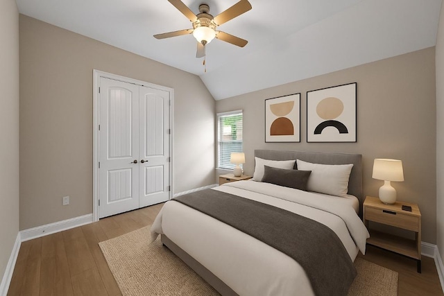 136 Firefall Ln, Austin, TX 78737 - bedroom with a closet, lofted ceiling, wood finished floors, and a ceiling fan