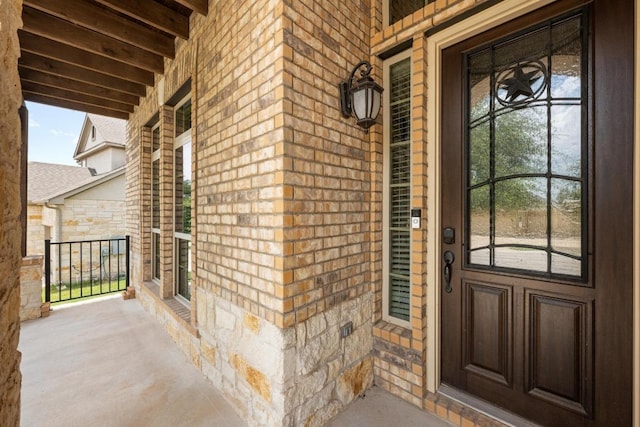 136 Firefall Ln, Austin, TX 78737 - entrance to property featuring covered porch, brick siding, and stone siding