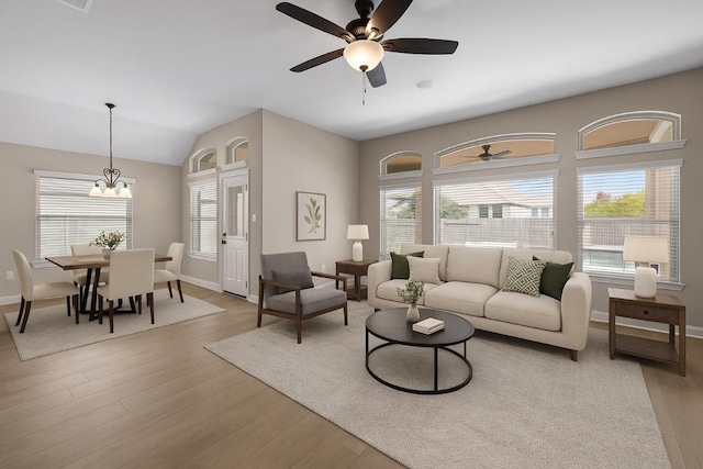 136 Firefall Ln, Austin, TX 78737 - living area with a ceiling fan, wood finished floors, plenty of natural light, and vaulted ceiling
