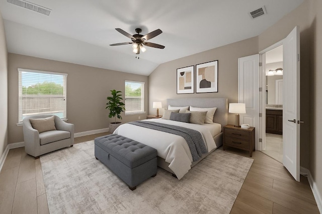 136 Firefall Ln, Austin, TX 78737 - bedroom featuring multiple windows, light wood finished floors, lofted ceiling, and a ceiling fan