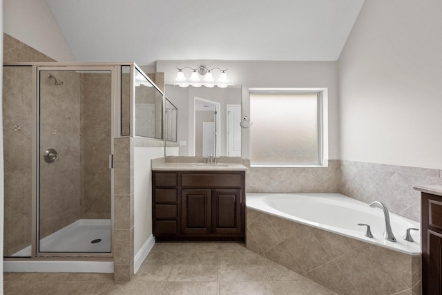 136 Firefall Ln, Austin, TX 78737 - full bath with vanity, a garden tub, a shower stall, and tile patterned floors