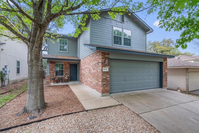 1509 Strickland Dr, Austin, TX 78748 - traditional home featuring an attached garage, brick siding, and driveway