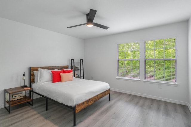 1509 Strickland Dr, Austin, TX 78748 - bedroom featuring multiple windows, light wood-style flooring, and a ceiling fan