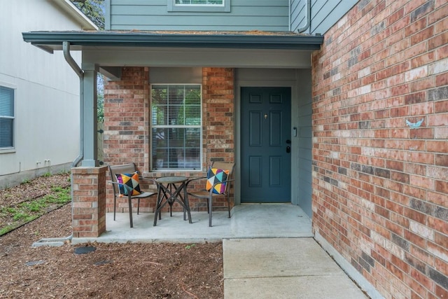 1509 Strickland Dr, Austin, TX 78748 - doorway to property featuring brick siding and a porch