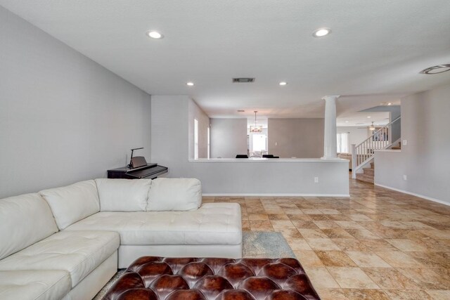 1511 Rhapsody Ridge Dr, Cedar Park, TX 78613 - living area with stairway, decorative columns, recessed lighting, and a chandelier
