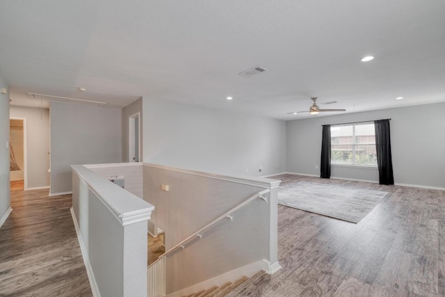 1511 Rhapsody Ridge Dr, Cedar Park, TX 78613 - spare room with attic access, wood finished floors, a ceiling fan, and recessed lighting