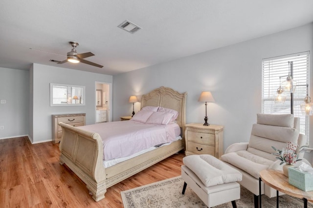 1511 Rhapsody Ridge Dr, Cedar Park, TX 78613 - bedroom featuring light wood-type flooring, connected bathroom, and ceiling fan